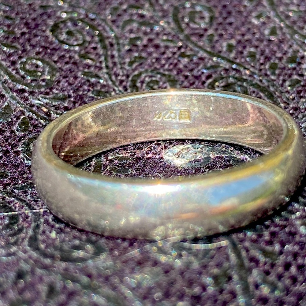 Heavy, thick sterling silver band.